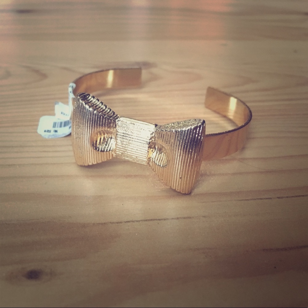 Francesca's gold bow cuff